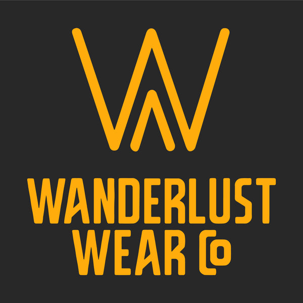 Wanderlust Wear Co. logo featuring bold golden lettering and stylized W icon on a dark background