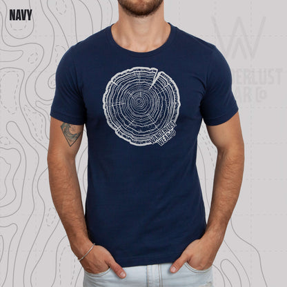 Model wearing Tree Rings Heritage graphic tee in Navy, featuring hand-drawn tree trunk cross-section design by Wanderlust Wear Co.